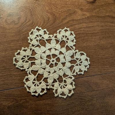 Variety for doillies, table cover, and a bonnet.