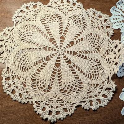 Variety for doillies, table cover, and a bonnet.