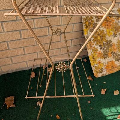 Vintage mid century, gold tone, wire plant or record stand.