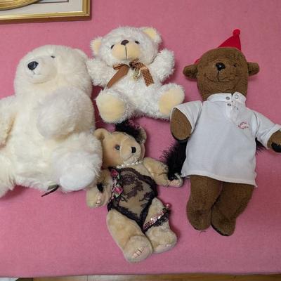 Group of 4 bears. The brown one is old.