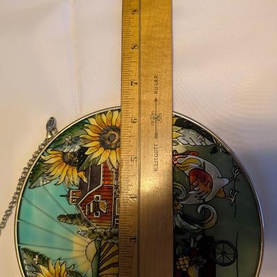 Two stained glass decorative pieces.