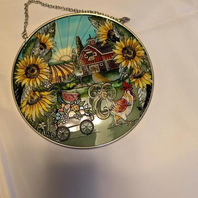 Two stained glass decorative pieces.