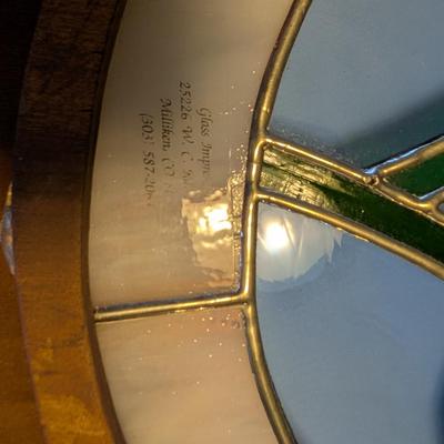 Two stained glass decorative pieces.