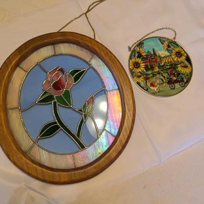 Two stained glass decorative pieces.