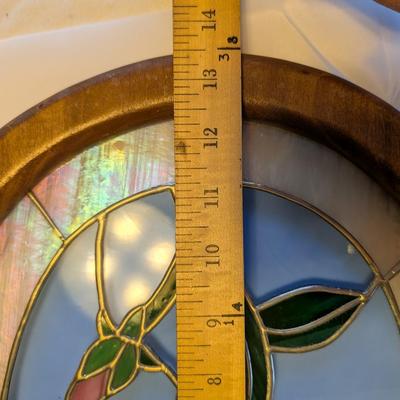 Two stained glass decorative pieces.