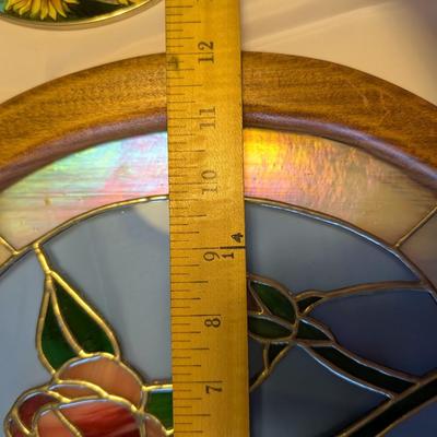 Two stained glass decorative pieces.