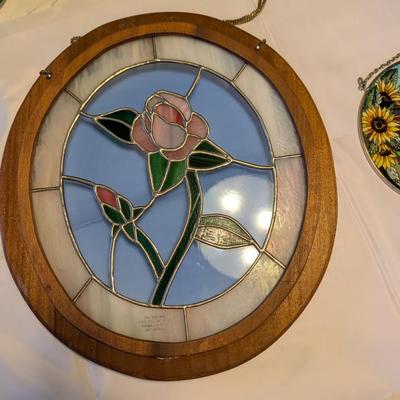 Two stained glass decorative pieces.