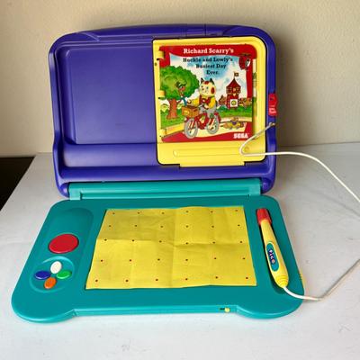 Sale Photo Thumbnail #497: From 2013. Very clean, has 1 storybook inside (see photos), power cord not included.  No games included. Untested.