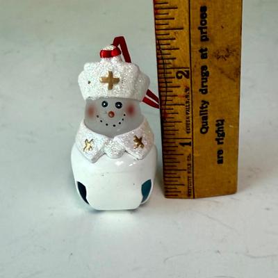 Sale Photo Thumbnail #515: Cute Glass ornament with a bell as a base. Approx. 2.25" tall.