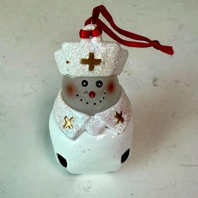 Sale Photo Thumbnail #511: Cute Glass ornament with a bell as a base. Approx. 2.25" tall.