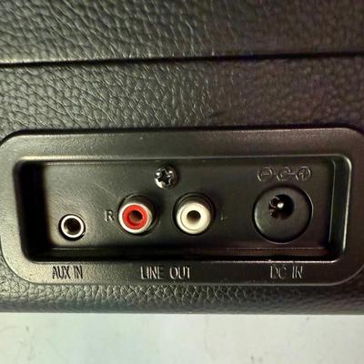 Sale Photo Thumbnail #520: Brief-case style portable turntable with built-in speakers. Has 9V power transformer and cord.  Model CR8005A. †tested, powers on and runs as expected.