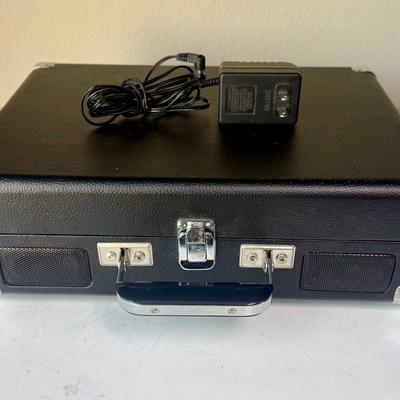 Sale Photo Thumbnail #517: Brief-case style portable turntable with built-in speakers. Has 9V power transformer and cord.  Model CR8005A. †tested, powers on and runs as expected.