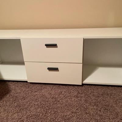 Long white with black handle tv stand