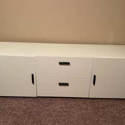 Long white with black handle tv stand