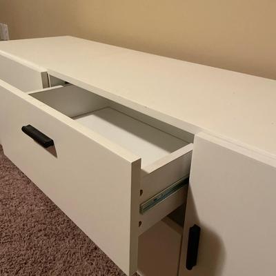 Long white with black handle tv stand
