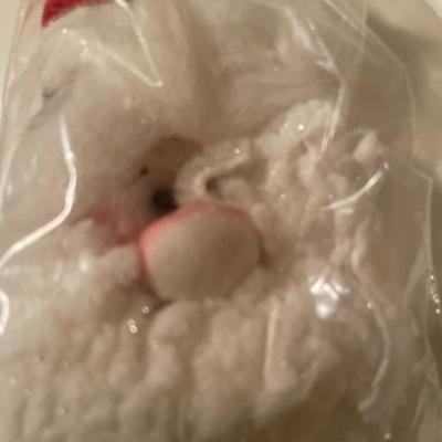 7 Santa pins in a small tote