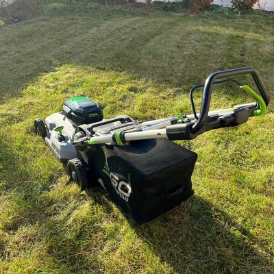 Sale Photo Thumbnail #57: Ego+ 21” wide self propelled electric lawn mower.  Comes with charging station, extra battery, and protective lawn mower cover.