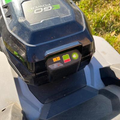 Sale Photo Thumbnail #56: Ego+ 21” wide self propelled electric lawn mower.  Comes with charging station, extra battery, and protective lawn mower cover.