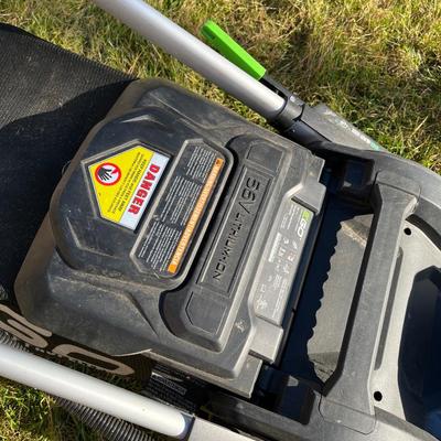 Sale Photo Thumbnail #59: Ego+ 21” wide self propelled electric lawn mower.  Comes with charging station, extra battery, and protective lawn mower cover.