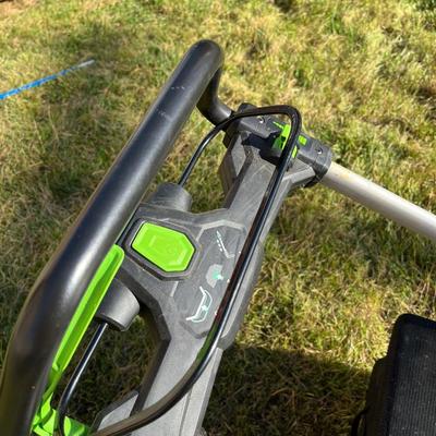 Sale Photo Thumbnail #58: Ego+ 21” wide self propelled electric lawn mower.  Comes with charging station, extra battery, and protective lawn mower cover.