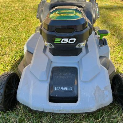 Sale Photo Thumbnail #55: Ego+ 21” wide self propelled electric lawn mower.  Comes with charging station, extra battery, and protective lawn mower cover.