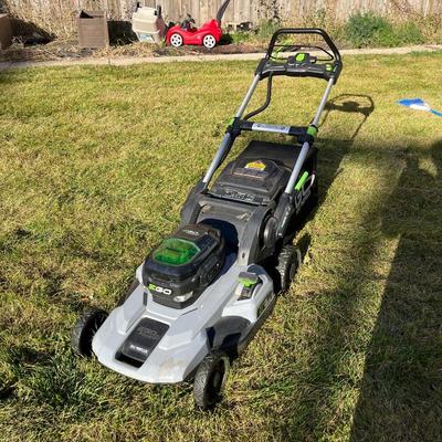 Sale Photo Thumbnail #54: Ego+ 21” wide self propelled electric lawn mower.  Comes with charging station, extra battery, and protective lawn mower cover.