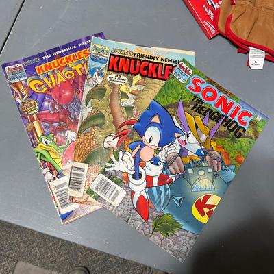 Sale Photo Thumbnail #394: Set of 3 sonic the hedgehog comics from Archie comics.  In fair condition and the knuckles comic has a lot of wear and tear.

*shipping available at buyers expense