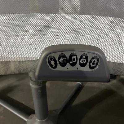 Sale Photo Thumbnail #78: Bassinet rotates around full 360 degrees and can swivel over your bed. Front section does fold down to help with picking up and putting down a baby.  Functions on the front controller all work and include faint lights, heart beat sound maker, volume contr