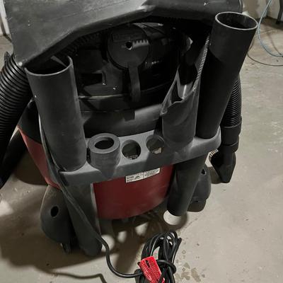 Sale Photo Thumbnail #157: 16 gallon shop vac with peak output of 6 hp.  Comes with a variety of attachments mounted onto the back.