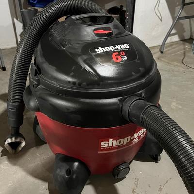 Sale Photo Thumbnail #155: 16 gallon shop vac with peak output of 6 hp.  Comes with a variety of attachments mounted onto the back.
