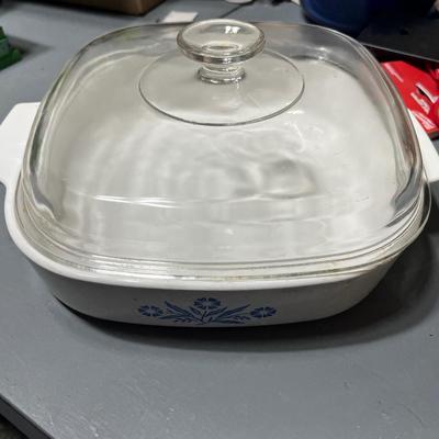 Sale Photo Thumbnail #258: Ceramic casserole dish with glass cover and blue flower pattern along the sides.