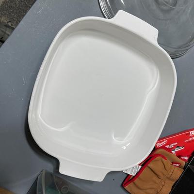 Sale Photo Thumbnail #260: Ceramic casserole dish with glass cover and blue flower pattern along the sides.