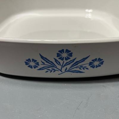 Sale Photo Thumbnail #259: Ceramic casserole dish with glass cover and blue flower pattern along the sides.