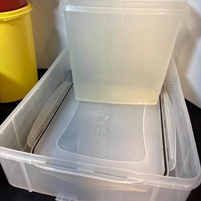 Sale Photo Thumbnail #41: Two yellow canisters, three bowls with lids, one large mixing bowl with lid and miscellaneous unmatched