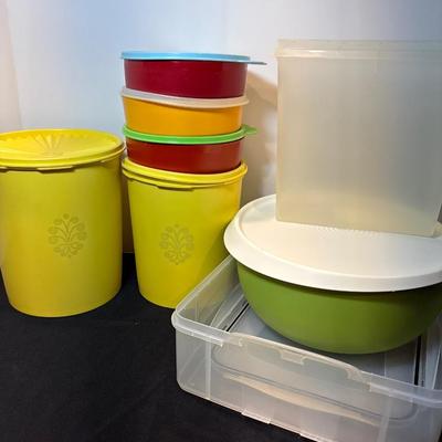 Sale Photo Thumbnail #37: Two yellow canisters, three bowls with lids, one large mixing bowl with lid and miscellaneous unmatched