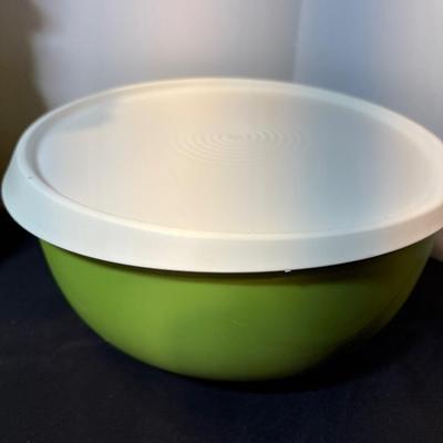 Sale Photo Thumbnail #40: Two yellow canisters, three bowls with lids, one large mixing bowl with lid and miscellaneous unmatched