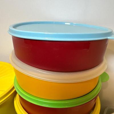 Sale Photo Thumbnail #39: Two yellow canisters, three bowls with lids, one large mixing bowl with lid and miscellaneous unmatched