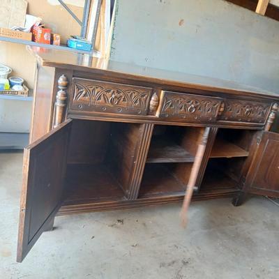 Antique oak Gothic Revival sideboard or buffet, likely English or Dutch, from the early 20th century