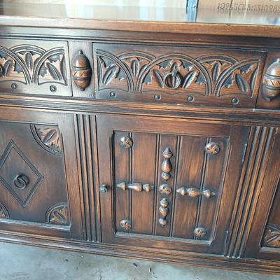 Antique oak Gothic Revival sideboard or buffet, likely English or Dutch, from the early 20th century