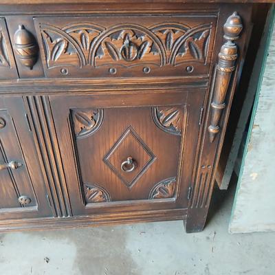 Antique oak Gothic Revival sideboard or buffet, likely English or Dutch, from the early 20th century