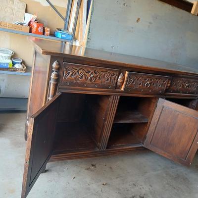 Antique oak Gothic Revival sideboard or buffet, likely English or Dutch, from the early 20th century