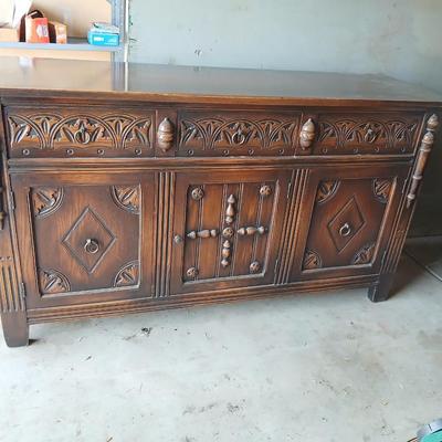 Antique oak Gothic Revival sideboard or buffet, likely English or Dutch, from the early 20th century
