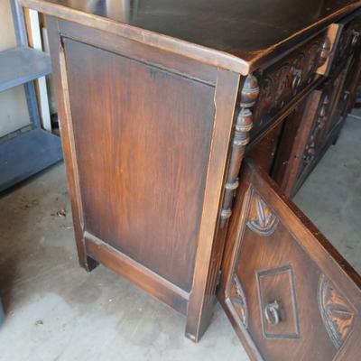 Antique oak Gothic Revival sideboard or buffet, likely English or Dutch, from the early 20th century