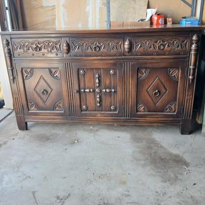 Antique oak Gothic Revival sideboard or buffet, likely English or Dutch, from the early 20th century