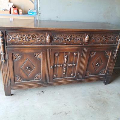 Antique oak Gothic Revival sideboard or buffet, likely English or Dutch, from the early 20th century