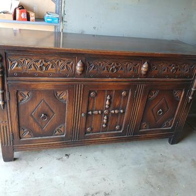 Antique oak Gothic Revival sideboard or buffet, likely English or Dutch, from the early 20th century