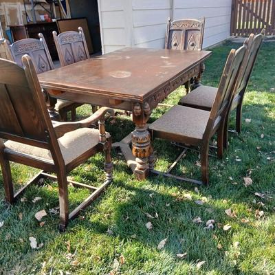 Antique dining room table with six matching chairs well over 100 years old!