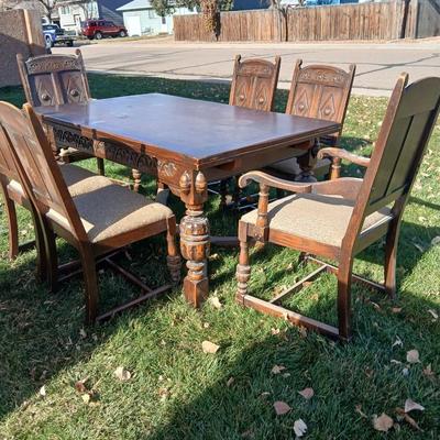Antique dining room table with six matching chairs well over 100 years old!