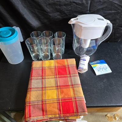 Brita water pitcher with new filter - Six drinking glasses, a tablecloth and a plastic pitcher with lid