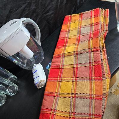 Brita water pitcher with new filter - Six drinking glasses, a tablecloth and a plastic pitcher with lid